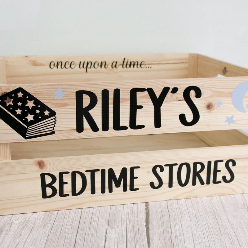 Wooden crate lettered “once upon a time… Riley’s Bedtime Stories” with a book illustration