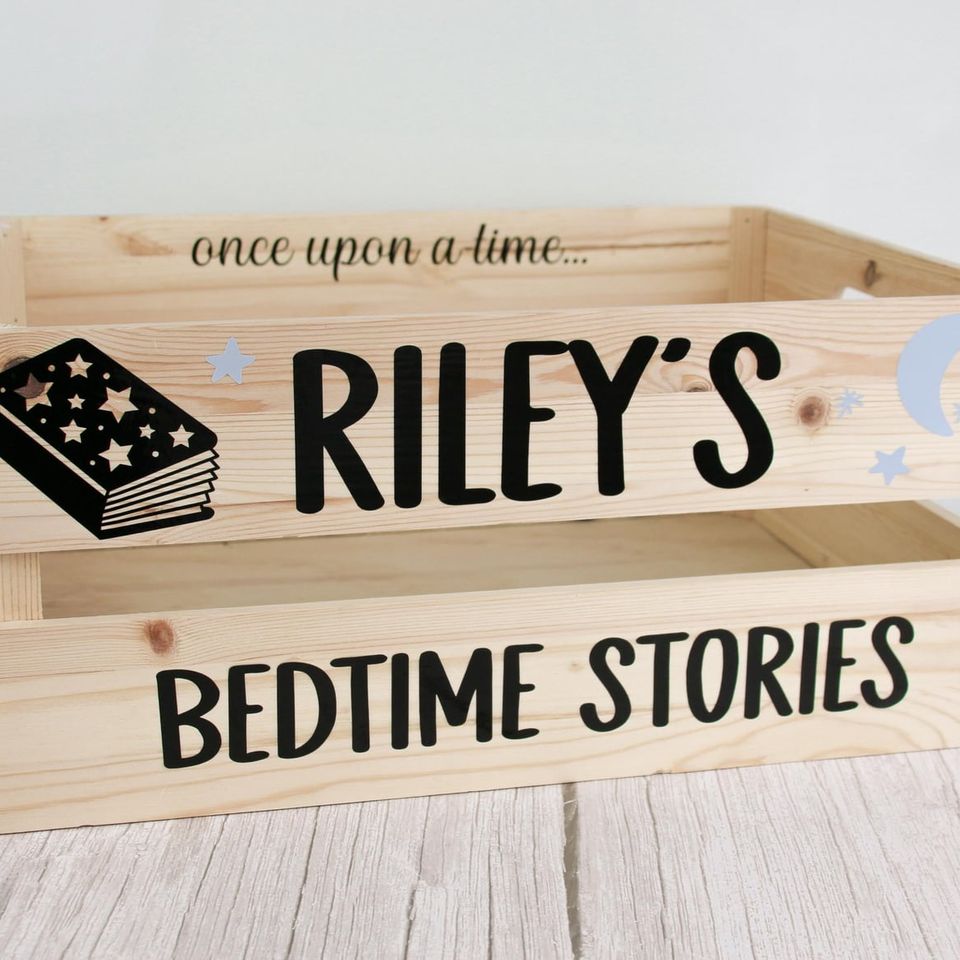Wooden crate lettered “once upon a time… Riley’s Bedtime Stories” with a book illustration