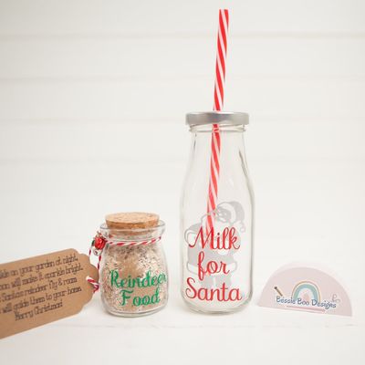 Small cork-topped jar of reindeer food and a glass “Milk for Santa” bottle with a striped straw