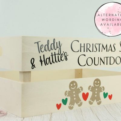Wooden crate lettered “Teddy & Hattie’s Christmas Story Countdown” with gingerbread figures