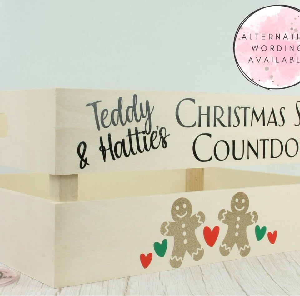 Wooden crate lettered “Teddy & Hattie’s Christmas Story Countdown” with gingerbread figures