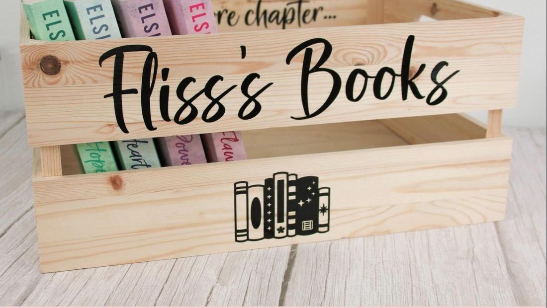 Decals reading “Fliss’s Books” on a wooden crate of books. Decal only, crate not included